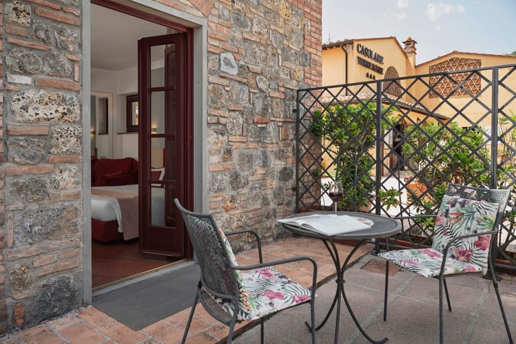 Private outdoor space with small table and chairs in the garden